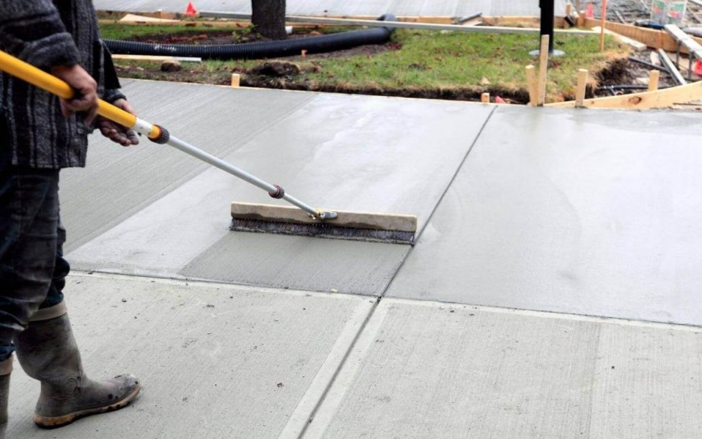 Genie Concrete Contractor Garland's Staff working on a Concrete Driveway project in Garland TX