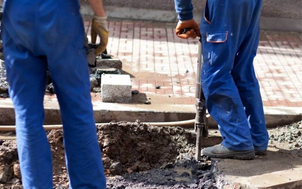 Genie Concrete Contractor Garland's Staff working on a Concrete Repair project in Garland TX