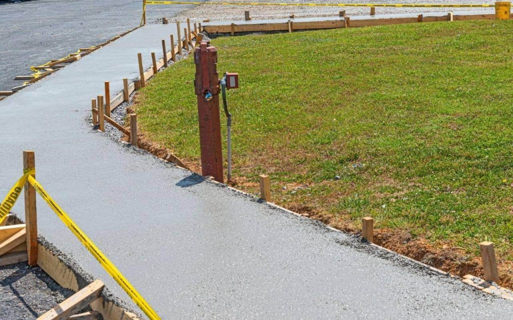 Genie Concrete Contractor Garland's Staff working on a Concrete Sidewalk project in Garland TX